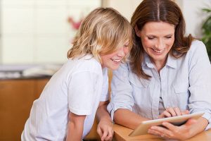 Mother and son using tablet